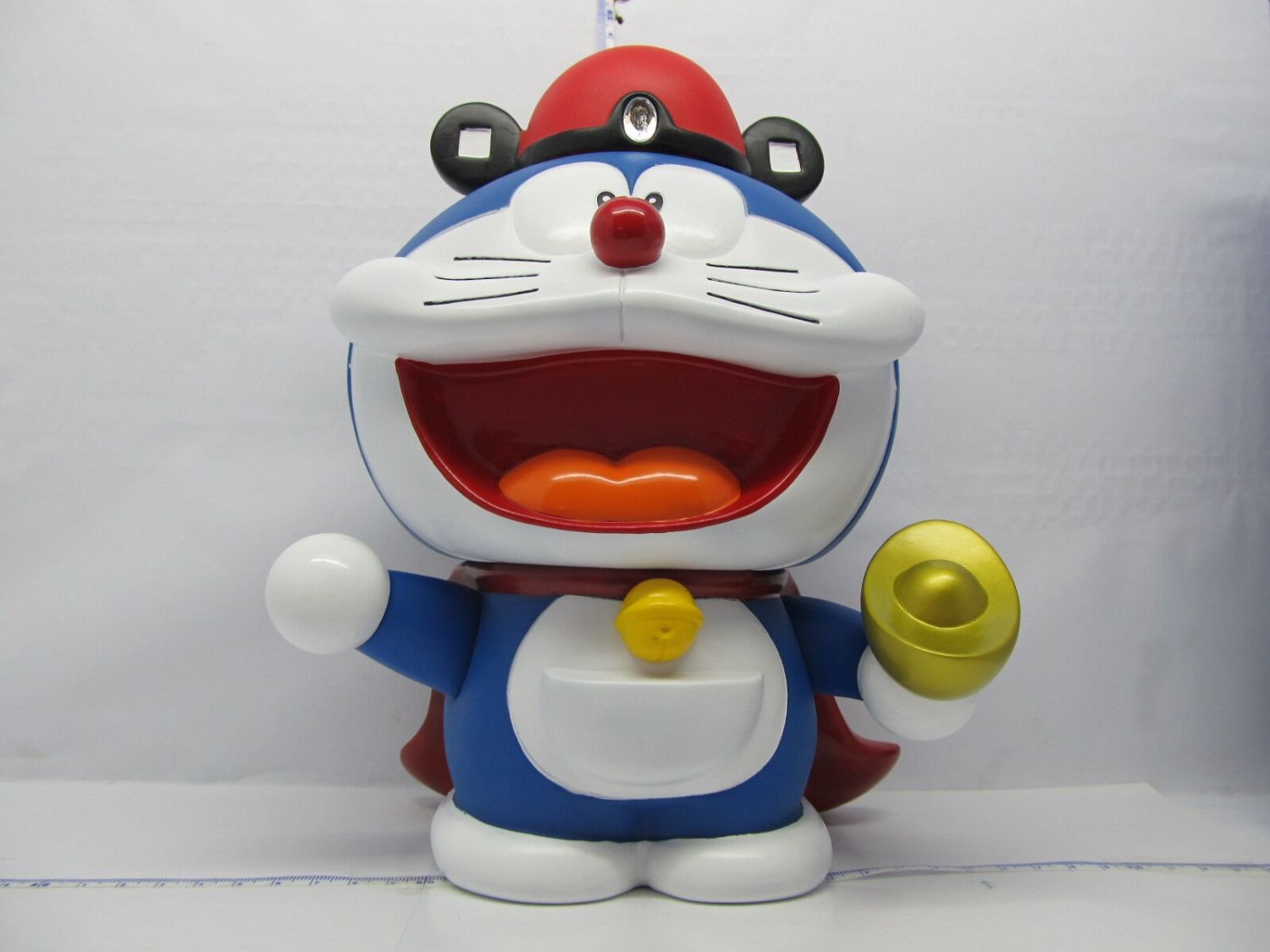 The Doraemon Piggy Bank Toy Helps Children Develop Good Saving Habits.