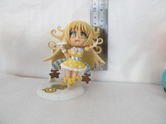 a Beautiful and Cute Yellow Girl Figure Made of PVC Material.