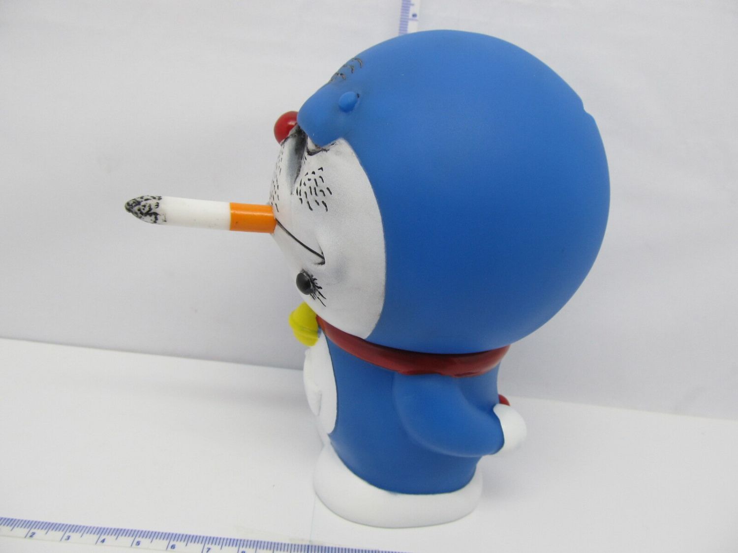 Doraemon Piggy Bank Toy with a Cool, Smoking Design