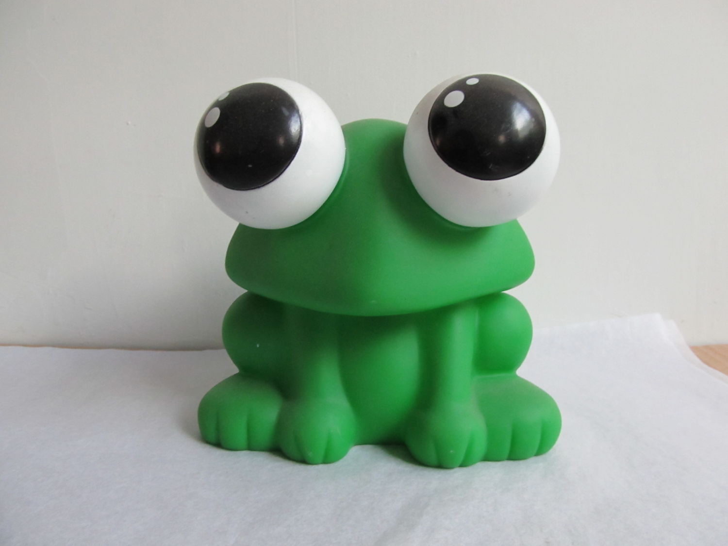 a Green Frog Plastic Toy That Children Love to Play with